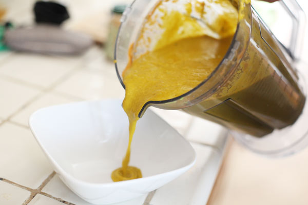 Pouring the soup into a bowl